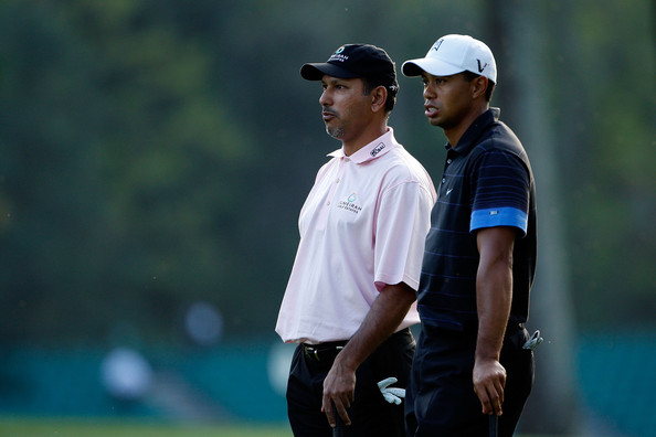 Jeev with Tiger Woods at the Masters Jeev holding up trophy